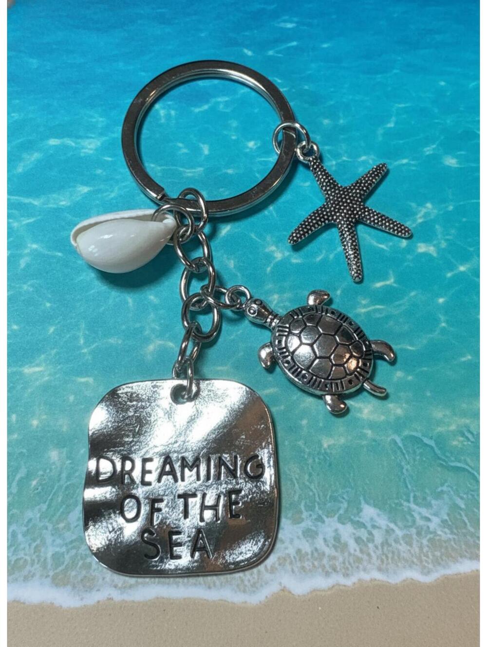 Silver-Tone Sea Charm Keychain with Dreaming of the Sea Tag